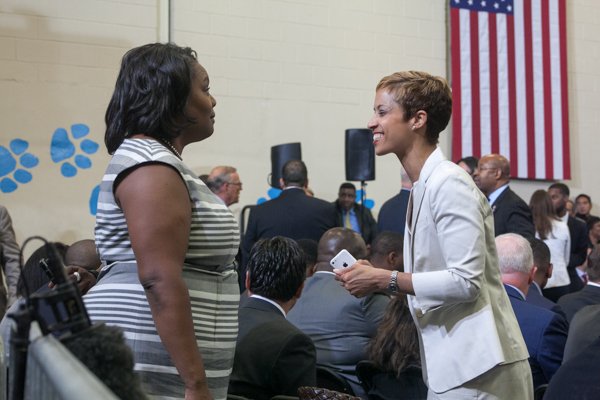 DCPS Chancellor Kaya Henderson with Education Deputy Chief of Staff Tyra Marianni at the town hall for the White House's "My Brother's Keeper" initiative held at Walker Jones Education Center on Monday, July 21.