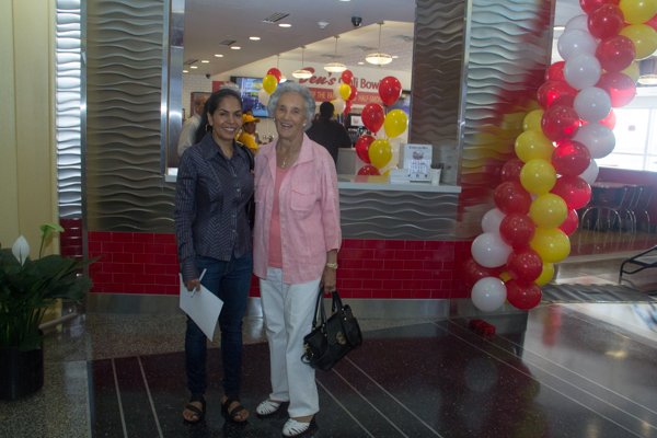 Vida Ali (left) and Virginia Ali (right) at Ben's Chili Bowl's opening of the newest location at National Airport in Arlington, Va., on Wed., July 23.
