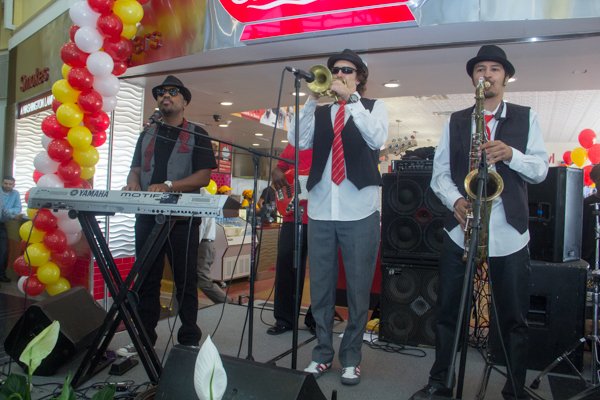 The Chuck Brown Band performs during the opening of Ben's Chili Bowl's newest location at National Airport in Arlington, Va., on Wed., July 23.