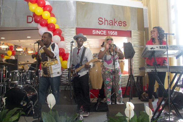The Chuck Brown Band performs during the opening of Ben's Chili Bowl's newest location at National Airport in Arlington, Va., on Wed., July 23.