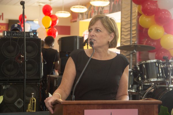 Margaret McKeough, chief operating officer of the Airports Authority speaks during the opening of Ben's Chili Bowl's newest location at National Airport in Arlington, Va., on Wed., July 23.