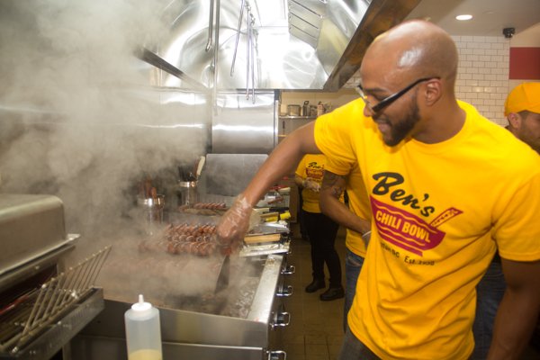 A cook at Ben's Chili Bowl's newest location at National Airport in Arlington, Va., on Wed., July 23.