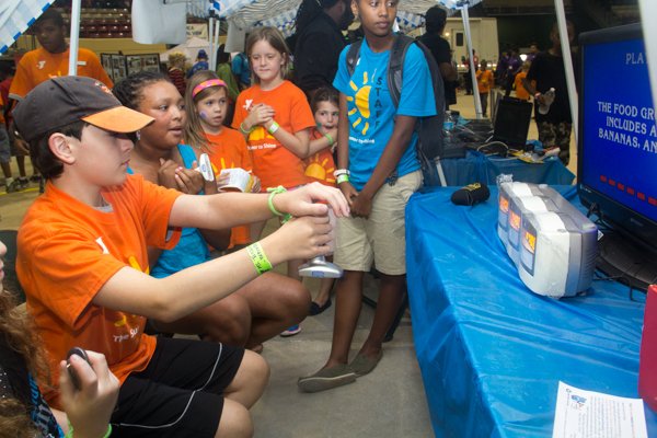 Ryan Freedman, Mikayla McDonald and Madison Poole play a game of Jeopardy during the Thingamajig Conference hosted by the YMCA of Metropolitan Washington at Show Place Arena in Upper Marlboro, Md., on Thurs., July 24.