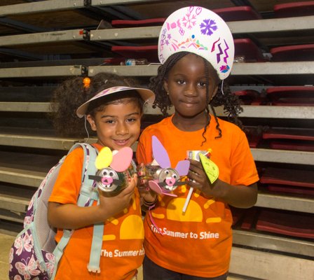 Fiona Bondares and Brittney Shelton show-off the rabbits they made out of soda cans at the Thingamajig Conference hosted by the YMCA of Metropolitan Washington at Show Place Arena in Upper Marlboro, Md., on Thurs., July 24.