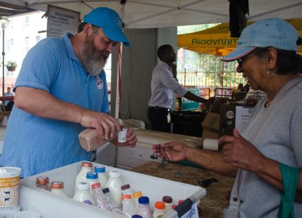 Dairy farmer sells produce at La Marqueta.