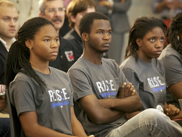 McKinley Tech students (seated left to right) J’Niya Butler, 15 , Cabrel Foyet-Fokov, 17 and Angel Collins, 15 at the grand opening of R.I.S.E. Demonstration Center located at St. Elizabeths East Wed., August 13.