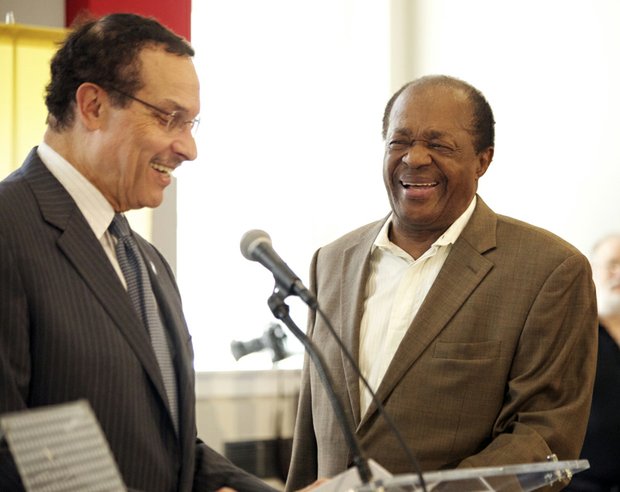 Mayor Vincent Gray invites Ward 8 Councilmember Marion Barry to the podium during the grand opening of R.I.S.E. Demonstration Center located at St. Elizabeths East, Wed., August 13.