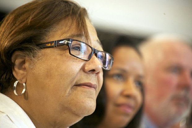 D.C. Council member Anita Bonds (at-large), Catherine Buell of St. Elizabeths East and Brian Hanlon, director of the Department of General Services, listen to Mayor Vincent Gray during the grand-opening ceremony of R.I.S.E. Demonstration Center at St. Elizabeths East on Wednesday, Aug. 13.