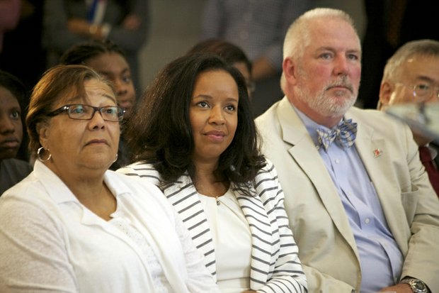 D.C. Council member Anita Bonds (at-large), Catherine Buell of St. Elizabeths East and Brian Hanlon, director of the Department of General Services, listen to Mayor Vincent Gray during the grand-opening ceremony of R.I.S.E. Demonstration Center at St. Elizabeths East on Wednesday, Aug. 13.