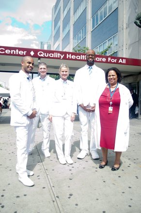 Doctors from the Harlem Hospital Center, School of Radiology showoff their extra white coats as the prepare to speak on-air at the WHCR- Harlem Community Radio booth. #HarlemWeek (08/17/2014)In the photo from left to right; Eladio Lopez, Jason Pepé, Kamilla Kijet, Lenworth Burnette and Stephanie Evans (Director of Education),