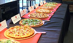 Inside the Pizza Hut test kitchen, the company lined a long table with about 11 new pies. They looked appetizing, ... Inside the Pizza Hut test kitchen, the company lined a long table with about 11 new pies. They looked appetizing, ...