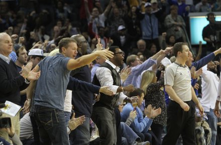 With a victory over the Atlanta Hawks in hand, fired-up Grizz fans celebrate as time winds down. (Photo: Warren Roseborough)