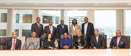 (l-r) (sitting) Christopher McDavid, Robert Johnson, Doreen Rachal, Stephanie S. Lovell, Sherry Williams, Damian Wilmot, Winston S. Kirton, (standing) Scott Mays, Jermaine Kidd, Bruce Jackson, John Shasanmi, Dominic Blue
On Saturday, February 7, 2015, the Massachusetts Black Lawyers Association (“MBLA”) hosted the third series of its Rainmakers’ Roundtable Program entitled, “In the Room: How to Successfully Bid on New Business.” The program was developed based on the Minority Corporate Counsel Association’s Creating Pathways to Diversity® Conference Blueprint Program held in July 2014, which was attended by Doreen M. Rachal, President of the MBLA and Assistant United States Attorney for the District of Massachusetts in the Asset Forfeiture Unit, and Jermaine Kidd, Co-Chair of the MBLA Programs and Professional Development Committee and an Associate at Morgan, Brown, & Joy, LLP. The program was held in the Boston office of Jones Day, the program sponsor, and featured a distinguished group of in-house counsel from across the United States. The program panel included the following: Photo credits Tony Irving.