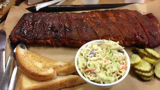 There's more than one bone of contention in the great finger-lickin' barbecue debate. Pork or beef? Vinegar- or tomato-based sauce? ... There's more than one bone of contention in the great finger-lickin' barbecue debate. Pork or beef? Vinegar- or tomato-based sauce? ...