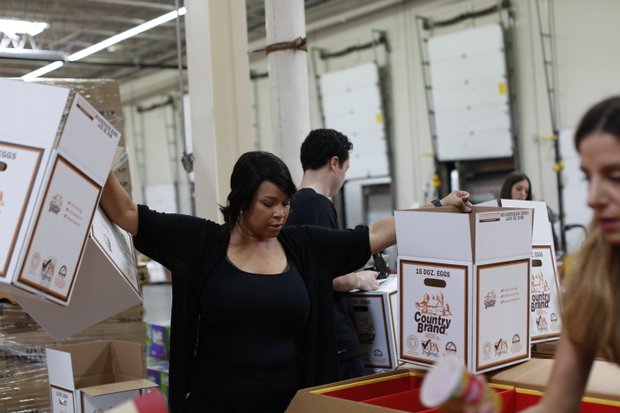Yukia Walker of TLC's CURVY BRIDES also helped sort and package for the morning