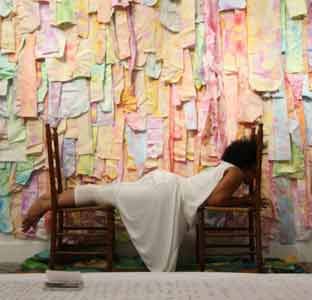 Ada Pinkston ’13 (Community Arts M.F.A.), This Bridge Called My Back or the never-ending labor of creating space to move past the isms, painted fabric, broom, paper, charcoal, book, projection, and live performer, 2015.