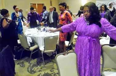 Honorees joined hands and prayed with event attendees at the second annual She Rose Awards, during Domestic Violence Awareness month.