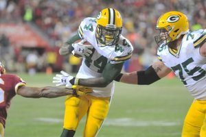 Green Bay Packers running back James Starks runs past Washington Redskins cornerback Bashaud Breeland for a touchdown during the Packers' 35-18 win in an NFC wild-card playoff game at FedEx Field in Landover, Md., on Jan. 10.