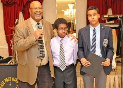 Ricardo Taylor, mayor of Pennsauken and Chairman of the Black Catholic Scholarship Committee with last year's scholarship winners. Stephen Malloy, 15, of Paul VI High School in Haddonfield and Myles Holder,15, a freshmen at St. Augustine High School in Richland.
