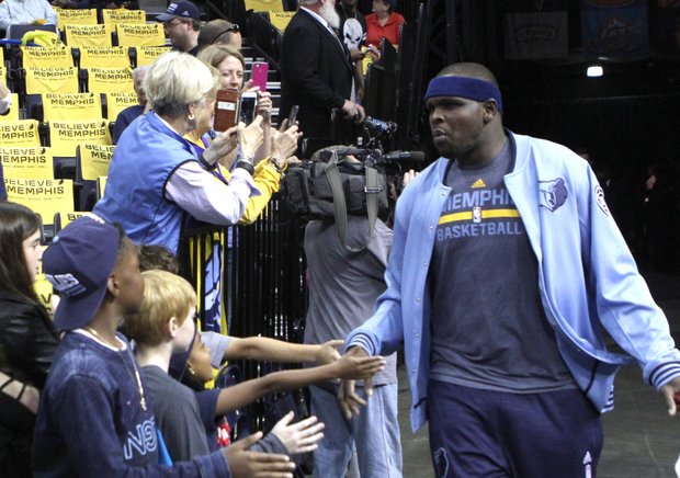 Zach Randolph has a low-fives greeting for revved up fans as he made his entry onto the FedExForum court. The crowd delivered NBA Playoffs-level support throughout the evening. (Photo: Warren Roseborough)