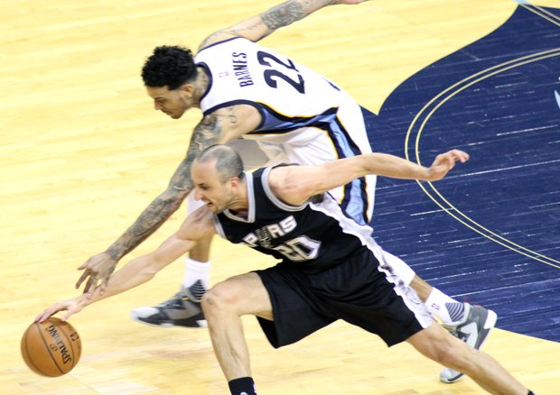 Matt Barnes, who was a force throughout the game, battles for possession with San Antonio’s Manu Ginobilli. (Photo: Warren Roseborough)