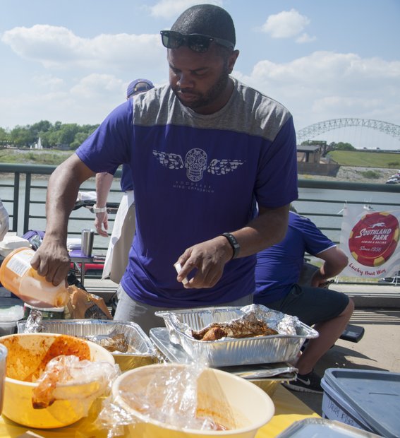 Fixing to please…
Elliot Smith, a multimedia specialist with eGrafixs, brought his mostly-secret recipe to Riverside Drive for the Southern Hot Wing Festival on Saturday. (Photo: Shirley Jackson)