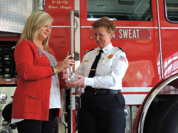 Our Fallen Heroes…
Memphis Fire Department Director Gina Sweat received the 2016 First Responder Award on Monday from Donna Kirk, founder of the Our Fallen Heroes Foundation, during a presentation at the fire station at 65 S. Front. Kirk is the widow of Lt. Trent A. Kirk, who died fighting a fire. Sweat said the fire department “family” still is grieving the recent death of Lt. Rodney Eddins. (Photo: Karanja A. Ajanaku)
