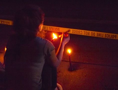 While some who gathered at the scene of the shooting of 32-year-old Philando Castile were highly vocal, yelling to the police, many were somber, holding signs and candles. (Photo: Harry Colbert, Jr./Insight News)