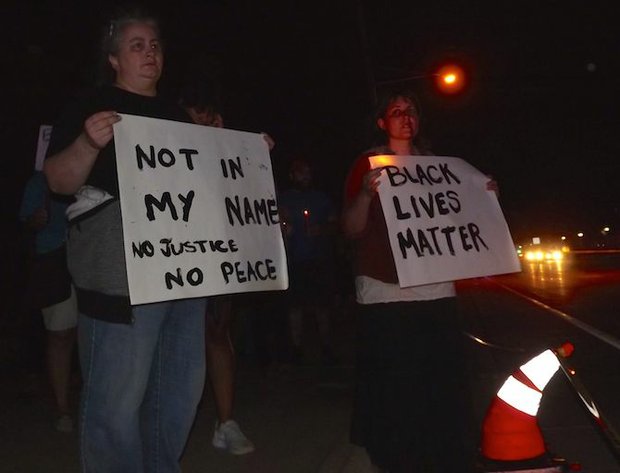 Protesters remained on the scene of the officer-involved shooting of 32-year-old Philando Castile until investigators concluded their work, approximately 1:45 a.m. Thursday morning. Castile and his girlfriend were stopped for a broken taillight in Falcon Heights, near the gates to Minnesota State Fair grounds. (Photo: Harry Colbert, Jr./Insight News)