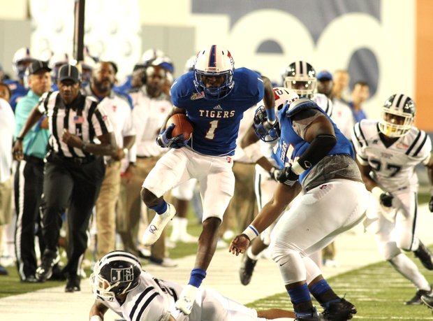 Tennessee State WR Steven Newbold hurdles a Jackson State defensive back during the 2016 Southern Heritage Classic. (Photo: Warren Roseborough)