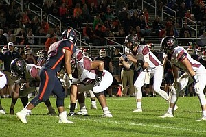 Plainfield North quarterback Brady Miller awaits the shotgun snap in the Tigers’ 12-0 loss against Oswego on Sept. 16.