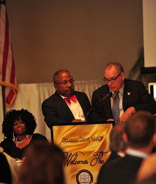 Master of Ceremony Dr. Warren S. Wallace, left, stands by as Wilfredo "Wil" Rojas, accepts the Dr. Irene Hill Smith Civil Rights Award at the Gloucester County NAACP Annual Freedom Fund Dinner and Game Changers Awards. -- Photo by Velvet S. McNeil/VelvetMultimedia.com