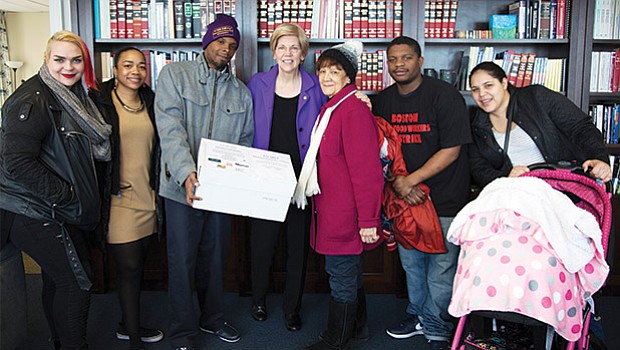 Activists delivered a petition to Sen. Elizabeth Warren (center) asking that she oppose the nomination of Andy Puzder, a fast-food CEO, to secretary of labor.