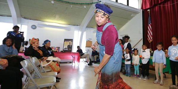 Nationally renowned storyteller, Queen Nur led the crowd and volunteers in an interactive song about George Washington Carver's inventions in crop rotation and products from made peanuts, soybeans and sweet potatoes at the Zeta Phil Beta Sorority, Inc Omicron Omicron Zeta Chapter & Williamstown Civic Group, Inc.'s "Making a Way Out of No Way African American Storytelling and Inventors' Museum" event.
-- Photo by April A. Ward