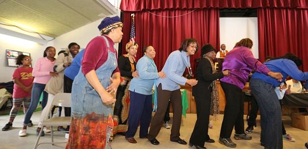 Nationally renowned storyteller, Queen Nur led the crowd and volunteers in an interactive song about George Washington Carver's inventions in crop rotation and products from made peanuts, soybeans and sweet potatoes at the Zeta Phil Beta Sorority, Inc Omicron Omicron Zeta Chapter & Williamstown Civic Group, Inc.'s "Making a Way Out of No Way African American Storytelling and Inventors' Museum" event.
-- Photo by April A. Ward