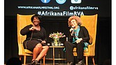 Scholar and activist Angela Y. Davis, right, and Tressie McMillan Cottom, a Virginia Commonwealth University assistant professor, react to a member of the audience during Dr. Davis’ appearance last Friday as the Afrikana Independent Film Festival’s 2nd Annual “Evening with an Icon.”