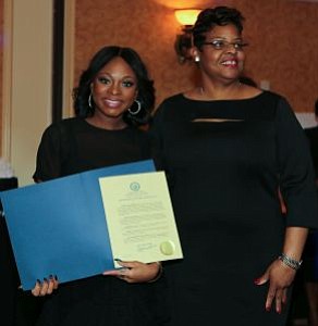 Naturi Naughton receives a proclamation from a member of the Office of the Mayor and Lawnside Borough Council. -- Photo by April A. Ward