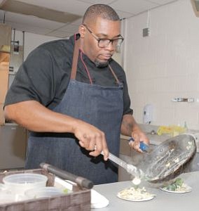 Award-Winning Chef Timothy Witcher of Food Network's Chopped preparing a plate of pasta at The South Jersey (NJ) Chapter of The Links Incorporated's On The Menu event. -- Photo by April A. Ward
