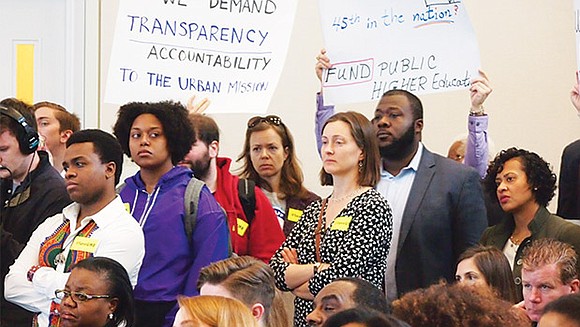 Students, faculty and staff from UMass Boston interrupted a meeting of the UMass Board of Trustees chanting “No cuts, no ... Students, faculty and staff from UMass Boston interrupted a meeting of the UMass Board of Trustees chanting “No cuts, no ...