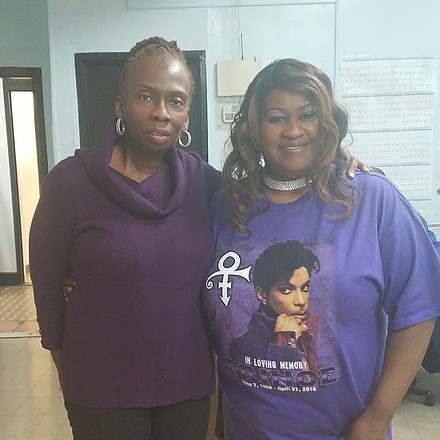 AmNews staffers Antoinette Donegan and Barbara Williams wearing their purple in honor of Prince