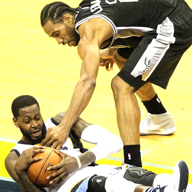 JaMychal Green dismisses Kawhi Leonard's handiwork and snares this loose ball. (Photo: Warren Roseborough)