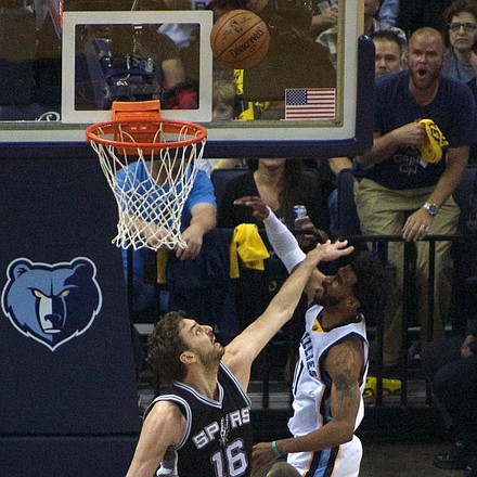 Mike Conley, who had a franchise postseason-record 35 points, charges the rim and San Antonio's Pau Gasol could not stop him. (Photo: Karanja A. Ajanaku)