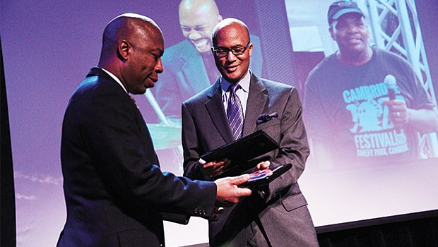 Berklee College of Music associate vice president Curtis Warner (right) presents the Berklee Urban Service Award to Professor Ron Savage for his work in establishing the Cambridge Jazz Festival and the Johnny Hodges Scholarship Fund.