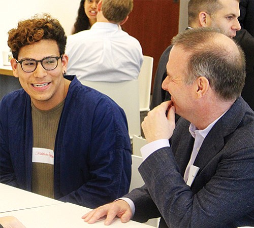 Jhonathan Perea, a junior studying microbiology at Boston University, was born in Colombia and grew up in Chelsea. He is talking with Tom Rutledge, head of fixed income generation for Magnetar Capital.