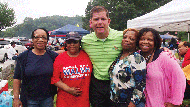 Diane Teal, Barbara Teal, Peachy White and Janet Teal enjoy a moment with Mayor Martin Walsh during Roxbury Homecoming in Franklin Park.