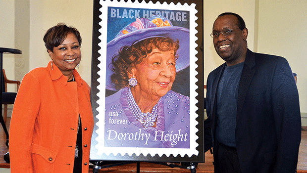 Dr. Valerie Roberson and Marshall Hughes, director of RCC’s Media Arts Center, pose with the commemorative Dorothy Height stamp, which was unveiled at the First Church of Roxbury on February 27.