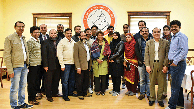 A group of administrators from technical colleges in Pakistan pose with Dr. Roberson. Each semester, administrators from Pakistan visit RCC to learn more about the community college system in the US.