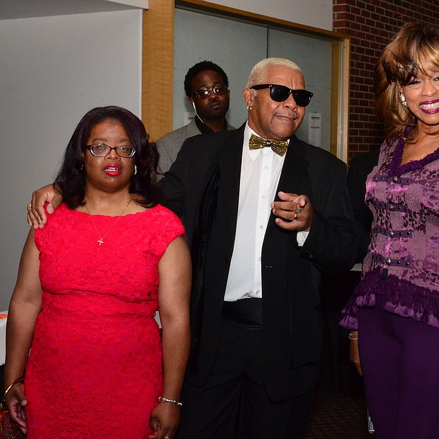 Larry Dodson of The Bar-Kays and his family stroll the red carpet.