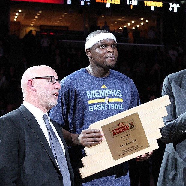 Z-Bo receives the Kia Community Assist award for the month of December 2013.
