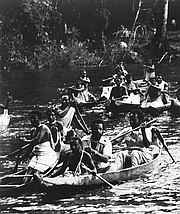 S. Allen Counter (in canoe in foreground) on a trip through the Suriname rainforest with the descendants of escaped African slaves.